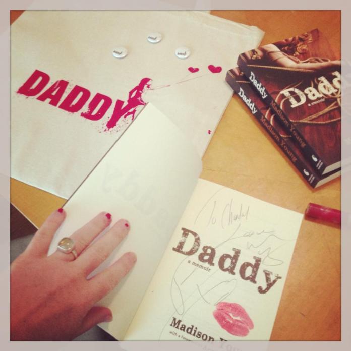Madison signs copies of Daddy.